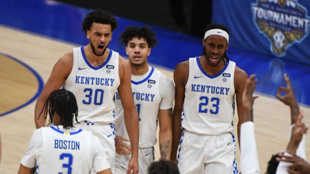 Mar 11, 2021; Nashville, TN, USA; Kentucky Wildcats forward Olivier Sarr (30) Kentucky Wildcats guard Dontaie Allen (11) and Kentucky Wildcats forward Isaiah Jackson (23) celebrate after a basket during the second half against the Mississippi State Bulldogs at Bridgestone Arena. Mandatory Credit: Christopher Hanewinckel-USA TODAY Sports